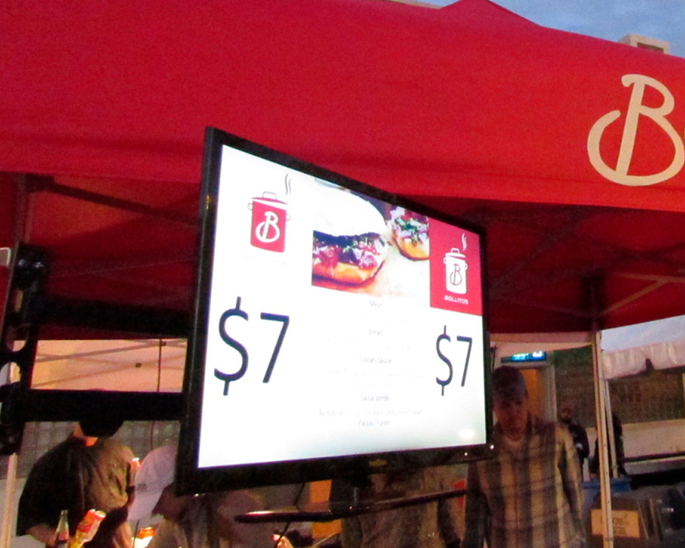 example of a TV mounted to a pop up up for displaying menu